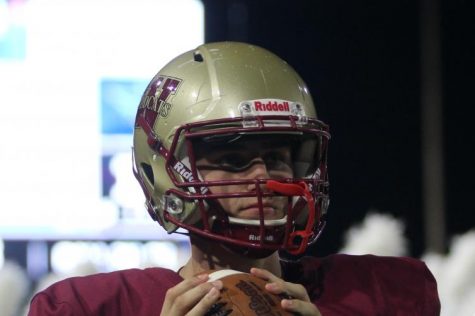 Senior Jackson Jones winds up for a throw at varsity football game against Tomball-Memorial on September 13. 